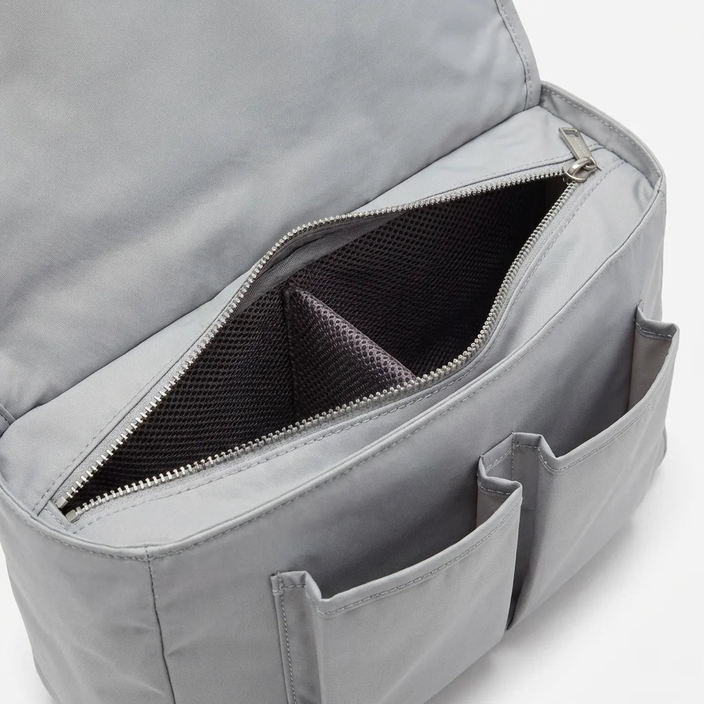 Tennis bag interior showing ventilated shoe compartment and pockets