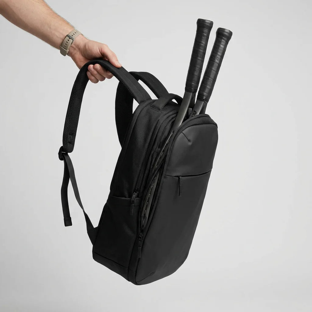 Tennis backpack size reference with hand for scale